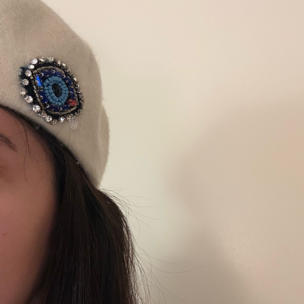Elegant White Wool Beret with Beaded Eye Design